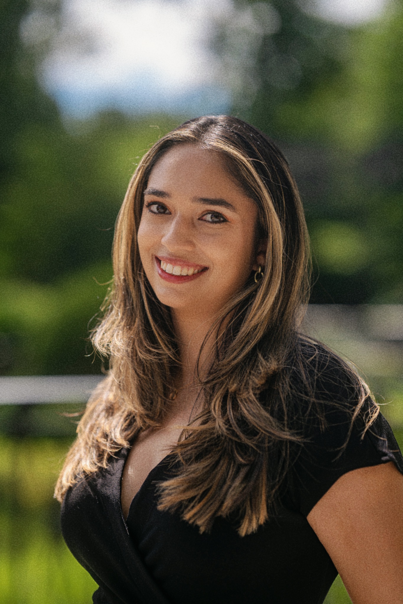 Kimberly Dsilva standing outdoors in a city park.
